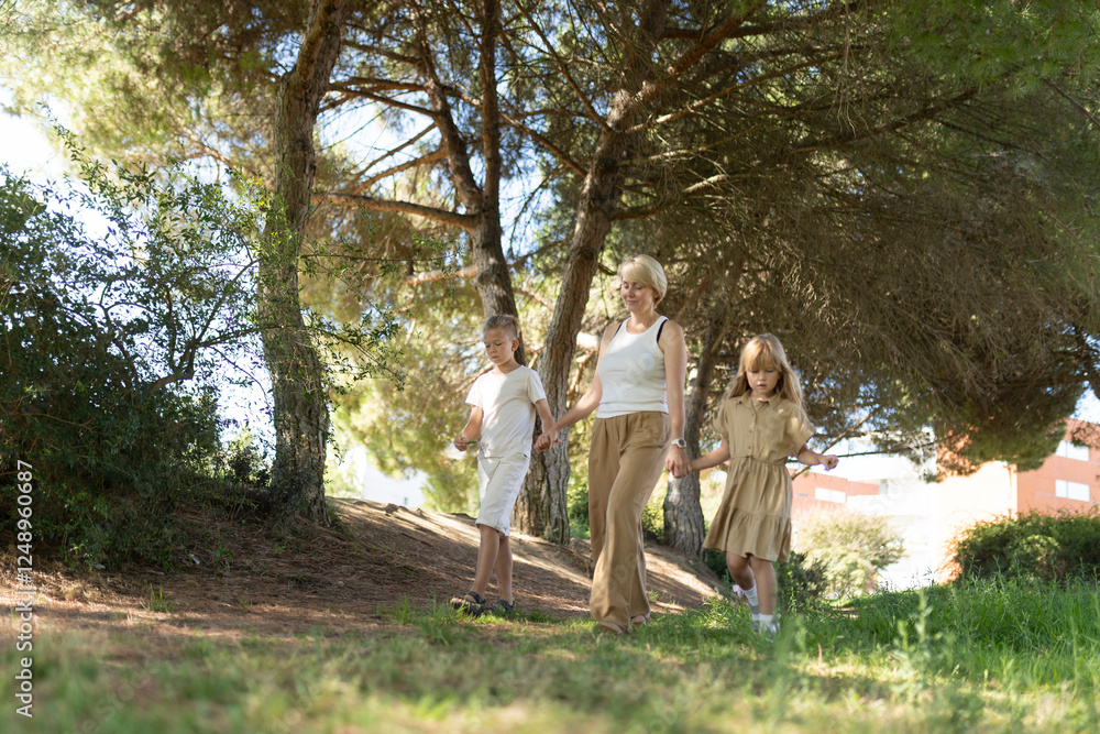 Fototapeta premium Family enjoying a peaceful walk in nature