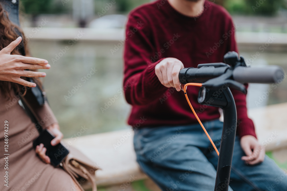 Two individuals interact next to an electric scooter in a city environment, suggesting modern urban lifestyle and mobility. One person holds a smart phone, highlighting technology use and Two individuals interact next to an electric scooter in a city environment, suggesting modern urban lifestyle and mobility. One person holds a smart phone, highlighting technology use and
