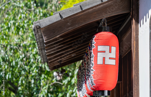 Traditional decorative paper Japanese style lanterns or lamps Chochin in a row at Adashino Nenbutsuji Temple. photo