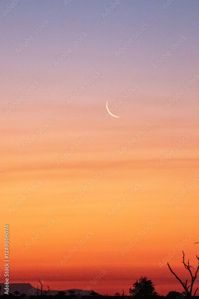 Sunset, with a new moon. Sunset, with a new moon.