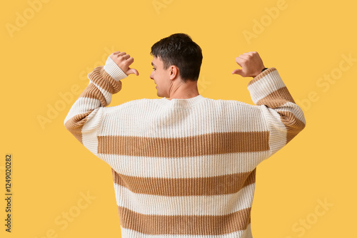 Young man pointing at styli...