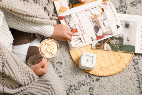 Young woman with cup of hot...