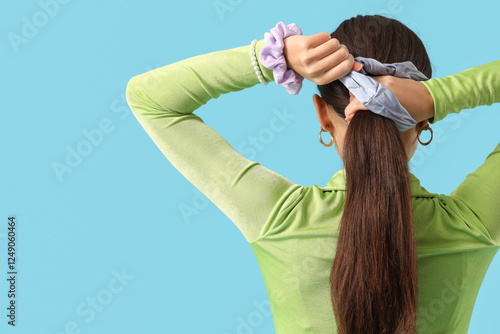 Young Asian woman using hai...
