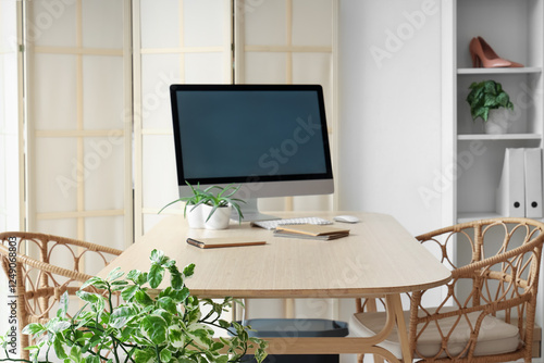 Workplace with blank comput...