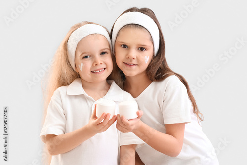 Cute little happy sisters w...