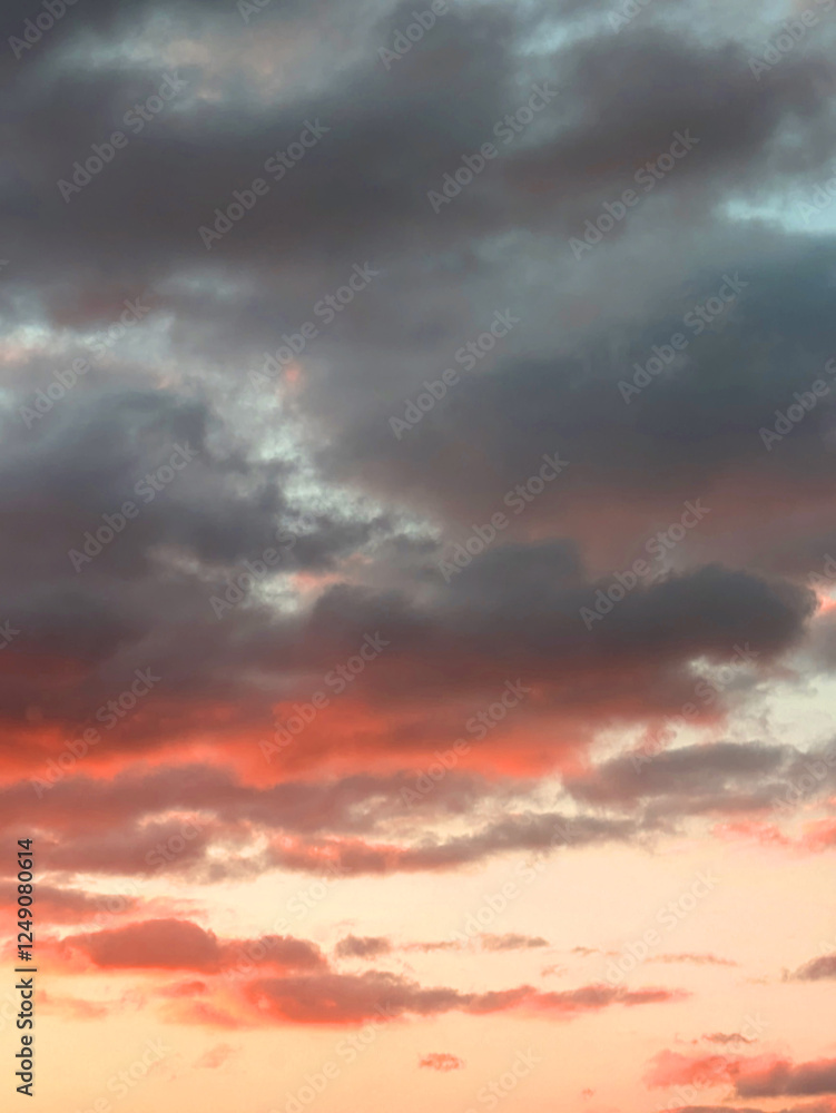 Obraz premium Calm Sunset Clouds In Reds and Blues Natural Background Skyscape