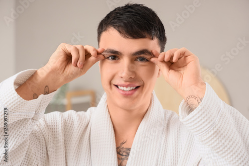 Young man doing face buildi...