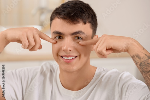 Young man doing face buildi...