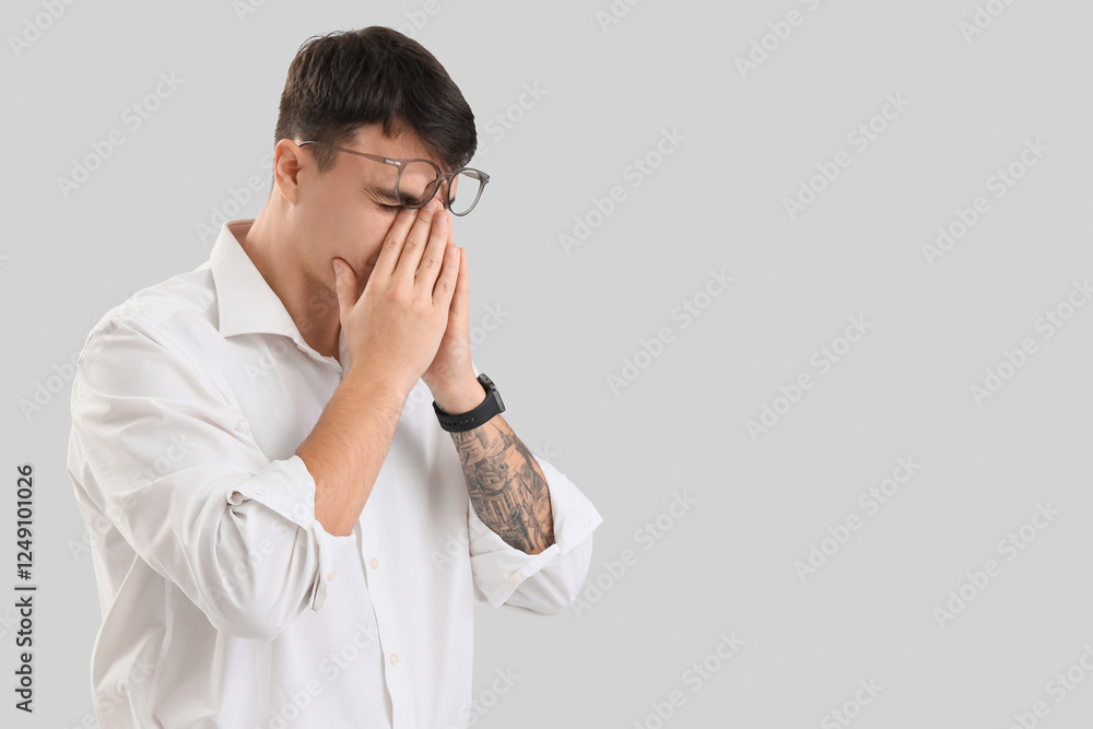 Worried male office worker on light background Worried male office worker on light background