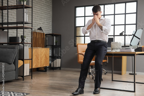 Worried male worker in office