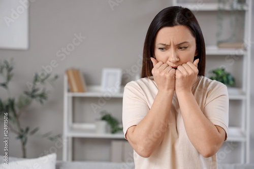 Portrait of worried woman a...