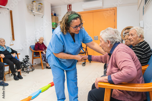 фотографія Caring nurse assisting elderly residents in nursing home