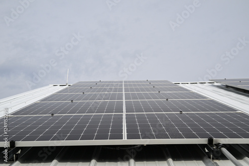 Foto Solar Panels on Metal Roof Renewable Energy Installation and a lightning rod sys