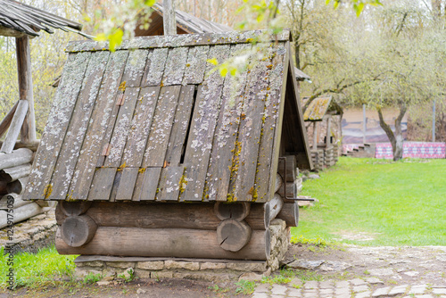 Old wooden well. Rustic well. Village. photo