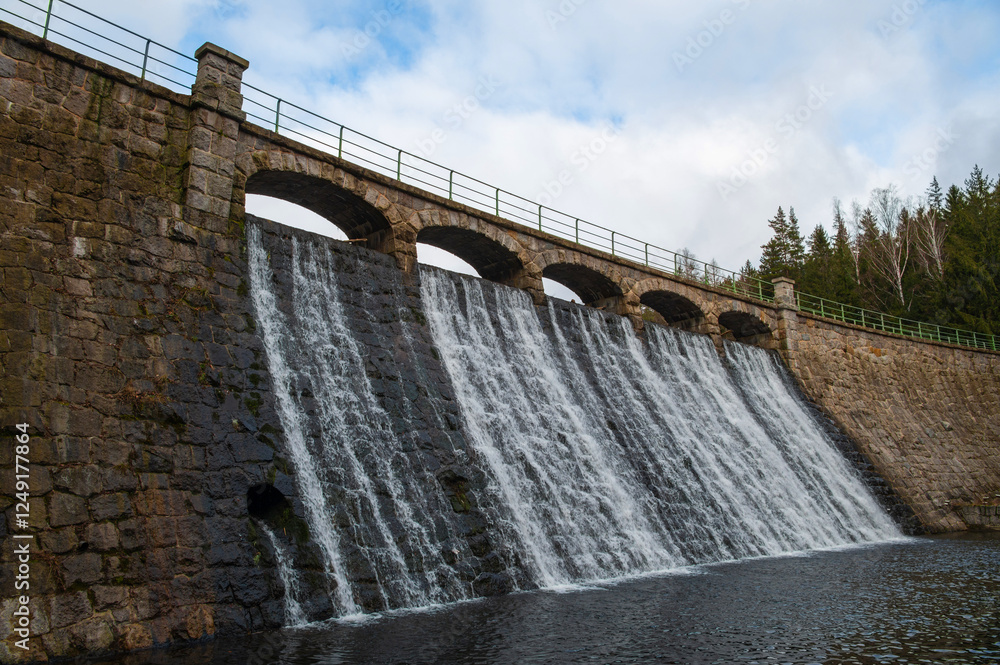 The Lomnica dam in Karpacz, Lower Silesian Voivodeship, Poland. River bed of the mountain river Łomnica in the Karkonosze Mountains The Lomnica dam in Karpacz, Lower Silesian Voivodeship, Poland. River bed of the mountain river Łomnica in the Karkonosze Mountains