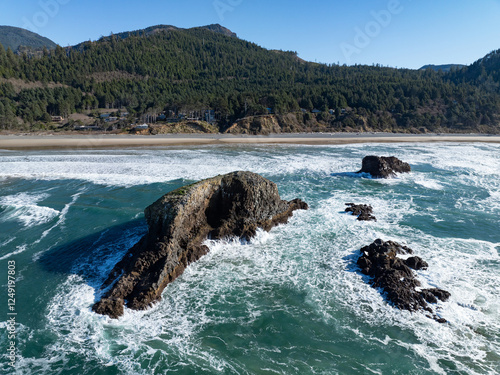 Wallpaper Mural The Pacific Ocean washes against sea stacks off the scenic Oregon coast. The many sea stacks along the west coast are formed by wave energy, hydraulic action, and wind erosion. Torontodigital.ca