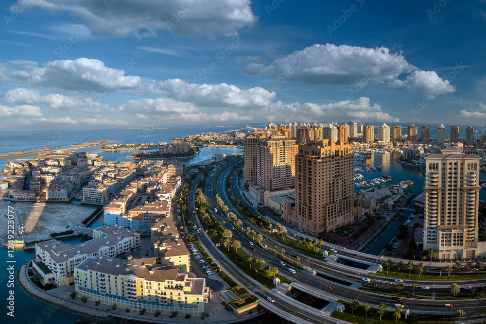 Obraz premium Doha, Qatar - December 20, 2024: Aerial view of Peral Qatar Porto Arabia with Doha Skyline early morning.