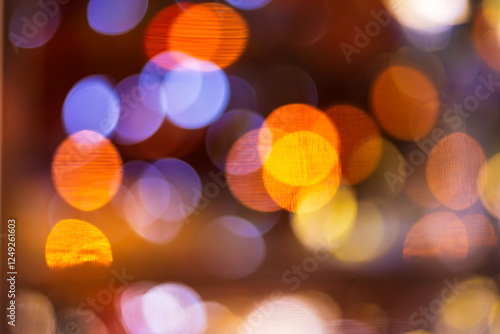 Orange bokeh lights background,Blurred orange bokeh background. Blur abstract background of urban light. Warm light with beautiful pattern of round bokeh. Orange light in the night. Street lamp blurre photo