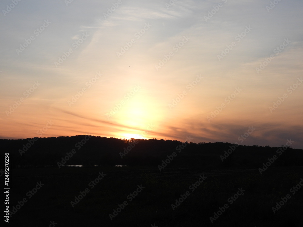 A beautiful sunset over the woodland forest of the Middle Creek Wildlife Management Area, Lancaster County, Pennsylvania. A beautiful sunset over the woodland forest of the Middle Creek Wildlife Management Area, Lancaster County, Pennsylvania.