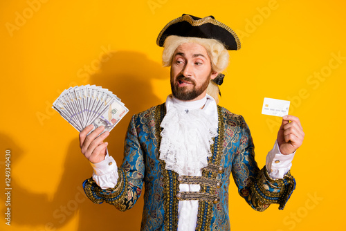 Tableau sur toile Man in 18th century noble costume creatively illustrating wealth with cash and c