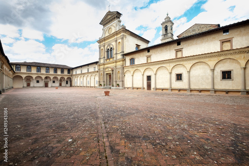Florence, Italy - the Facade of the Church of San Lorenzo at the Florence Charterhouse Framed by Sharp Shadows Against a Blue Sky With Light Clouds