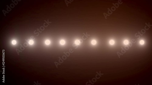 Flashes of spotlights of different shapes on the wall.