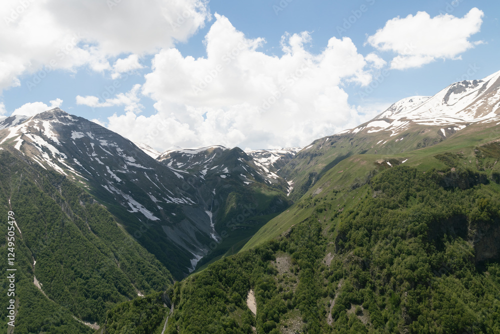 Fototapeta premium the landscape of mountains in Georgia.Snow-capped mountain peaks against a blue sky