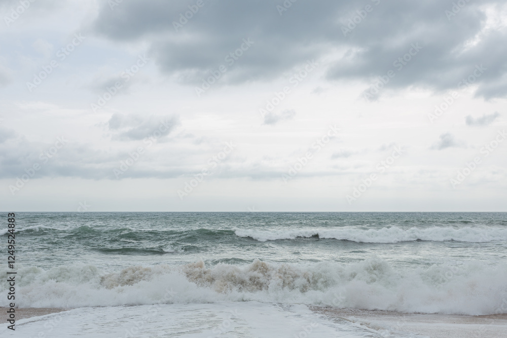The ocean is rough and the sky is cloudy. The waves are crashing against the shore. Mediterranean sea The ocean is rough and the sky is cloudy. The waves are crashing against the shore. Mediterranean sea