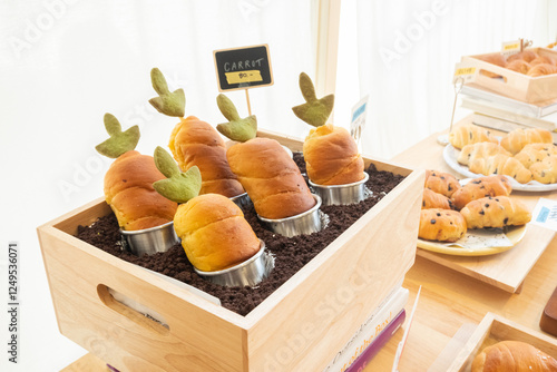 Fresh Baked Carrot bread,Shio Pan or Japanese sea salt butter bread rolls in bakery shop,Homemade pastry with sesame,japan or korea bakery shop,copy space. photo