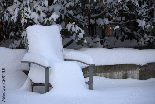 Wallpaper Mural Snow covered a chair outdoors. Time after snowfall. Torontodigital.ca