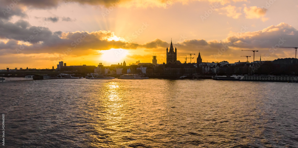Panorama of the sunset over the historic town and Rhine river in Cologne, Germany