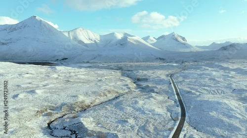 Road heading towards the peaks of Sgurr Mhairi, Beinn Deard Mhor, the Red and Black Cuillins, Isle of Skye, Highlands, Scotland, United Kingdom