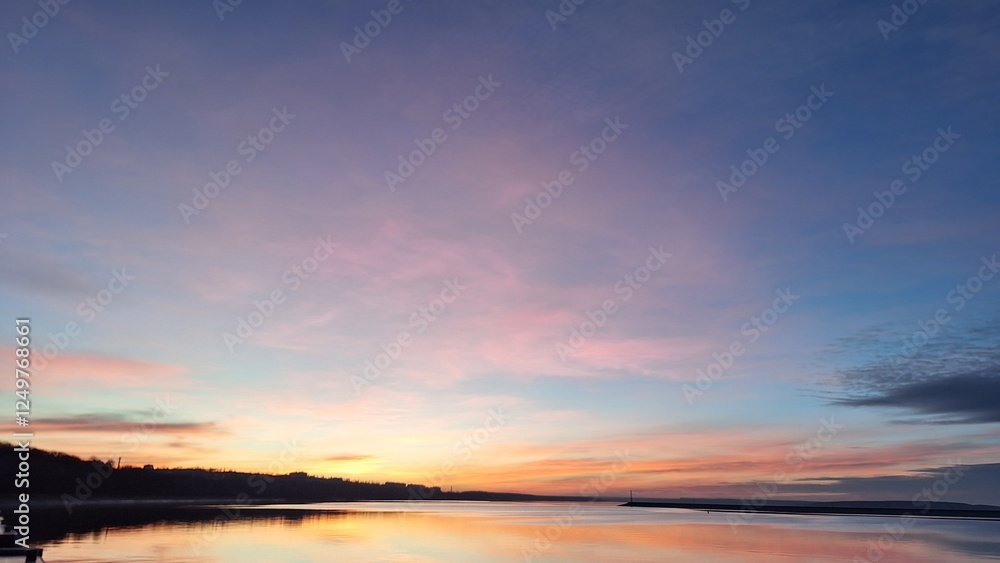 Vibrant Evening Sky Reflected in Still Water Vibrant Evening Sky Reflected in Still Water