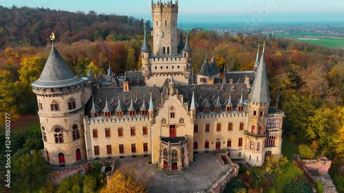 Aerial drone view of medieval castle Marienburg in forest on hill near Hanover in Lower Saxony, Germany. High quality 4k footage