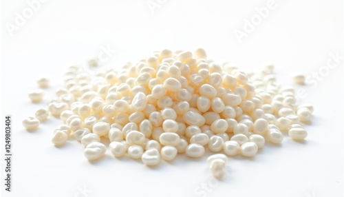 Close up view of many small white sago pearls piled on white background. Raw food ingredient for Asian cuisine. Natural food source with delicate texture. Perfect for cooking dessert. High-quality