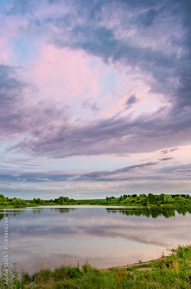 Fototapeta premium Lake with a cloudy sky in the background