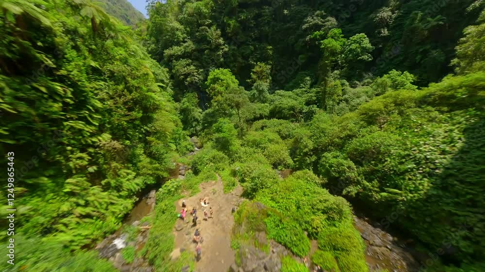Dynamic FPV drone dive near the cascading Sekumpul Waterfall, Bali, Indonesia Dynamic FPV drone dive near the cascading Sekumpul Waterfall, Bali, Indonesia