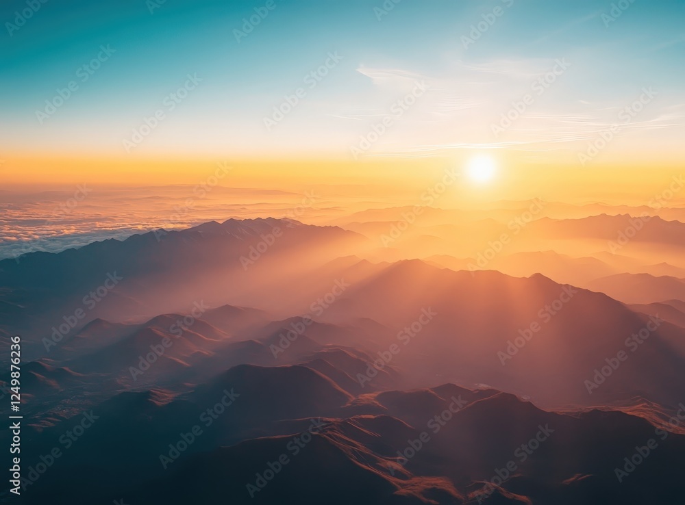 Aerial view of mountains and hills during golden sunset with blue skies and clouds Aerial view of mountains and hills during golden sunset with blue skies and clouds