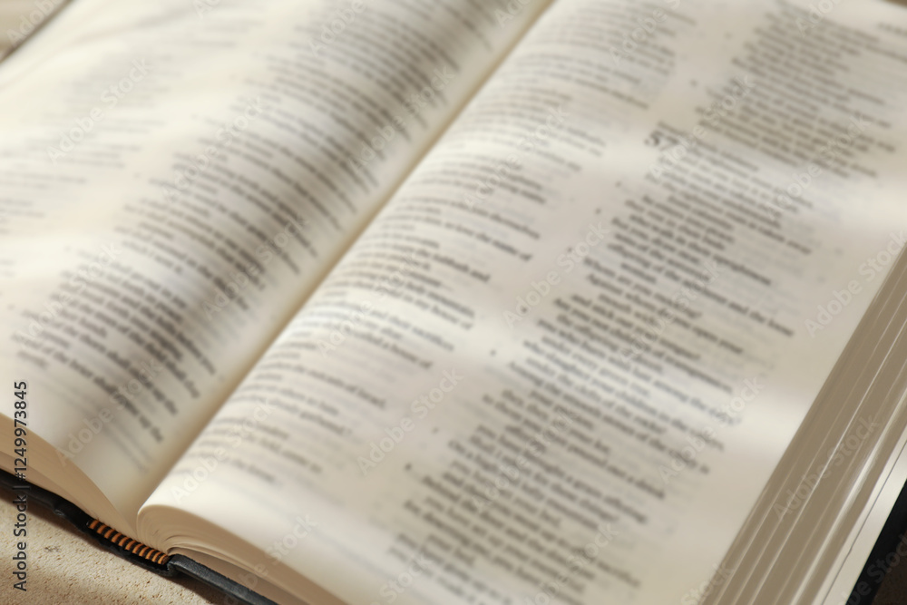Open Holy Bible in English language on table, closeup Open Holy Bible in English language on table, closeup