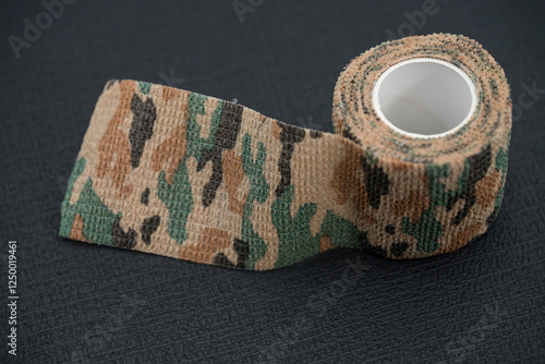 camouflage tape, self-adhesive elastic tape made of non-woven material for hunting and tactical use, versatile elastic camouflage tape for equipment photo