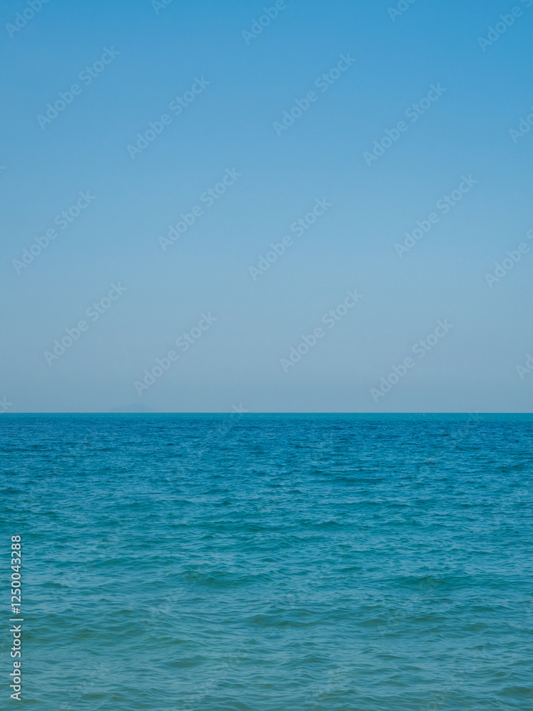 Obraz premium Photography landscape beautiful summer season vertical look view horizon tropical shore open sea cloud clean blue sky background calm nature ocean wave water nobody travel at Thailand sun day time.