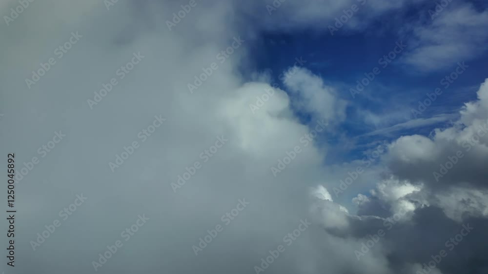 A pilot’s perspective FPV POV while flying through white stormy clouds under a blue sky. An immersive view through the pilot’s eyes. 4K 60FPS A pilot’s perspective FPV POV while flying through white stormy clouds under a blue sky. An immersive view through the pilot’s eyes. 4K 60FPS