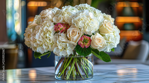 beautiful arrangement of white flowers and pink accents in clear vase, perfect for any occasion
