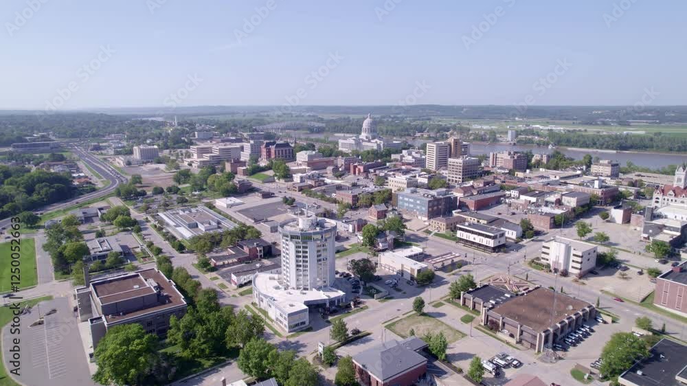 Soar through the skies over Jefferson City, showcasing the majestic Capitol building and its surroundings. Soar through the skies over Jefferson City, showcasing the majestic Capitol building and its surroundings.