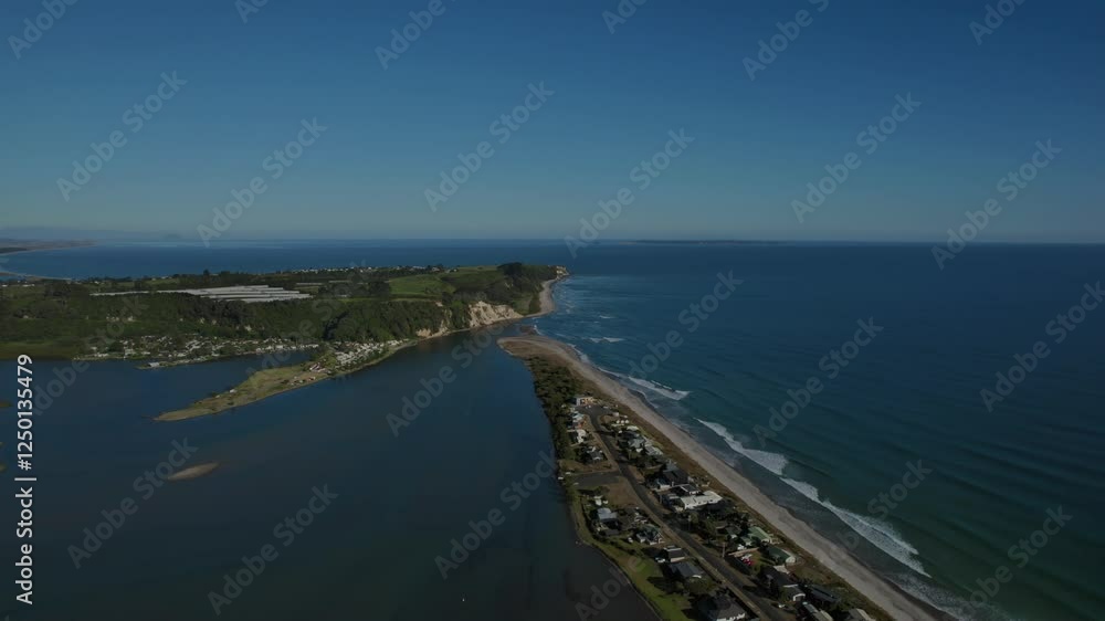 Beautiful aerial view of Pukehina Beach with a mix of ocean and lush landscape Beautiful aerial view of Pukehina Beach with a mix of ocean and lush landscape