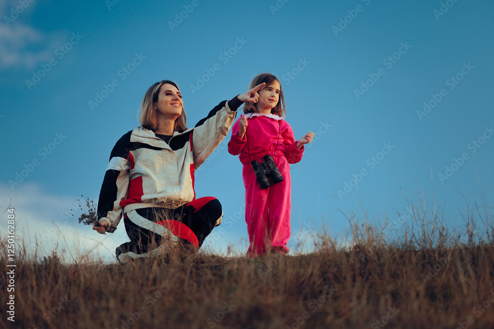 Happy Kid Looking into the Distance with Binoculars. Visionary girl exploring and observing the environment
Happy Kid Looking into the Distance with Binoculars. Visionary girl exploring and observing the environment