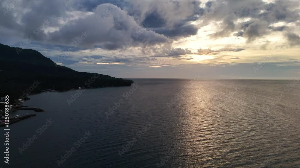 Dusk Sunset Evening Fly over Camiguin Island, the Philippines. Asia Tropical skies. Orange, red, purple coloration Thailand Mindanao 