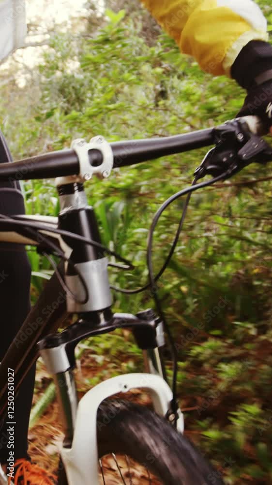 Male mountain biker riding in the forest Male mountain biker riding in the forest