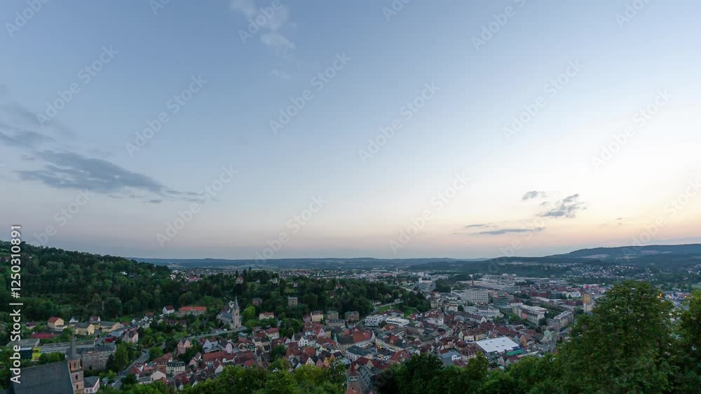 A stunning timelapse capturing the sunset over Kulmbach, Germany, as seen from the historic Plassenburg Fortress, with the cityscape below. A stunning timelapse capturing the sunset over Kulmbach, Germany, as seen from the historic Plassenburg Fortress, with the cityscape below.