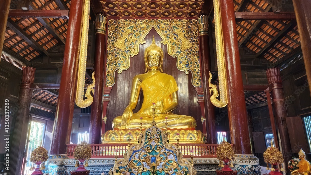 Fototapeta premium Golden Buddha Statue Inside Ornate Temple Hall with Colorful Details